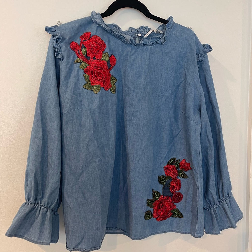 Women’s long sleeve denim blouse with red flower print. Size is 2XL